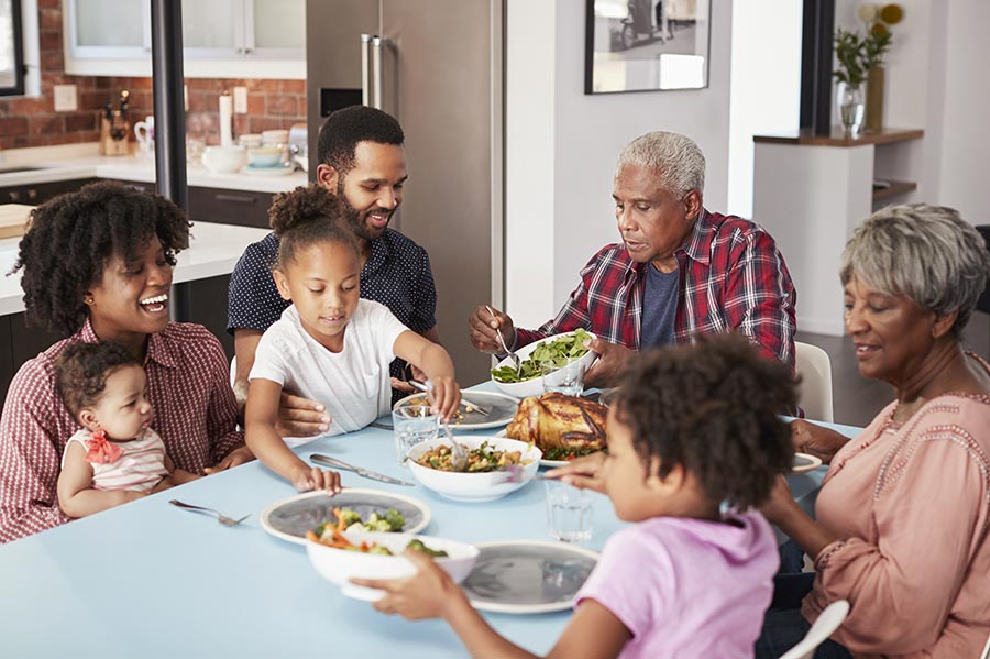 Happy family eating together