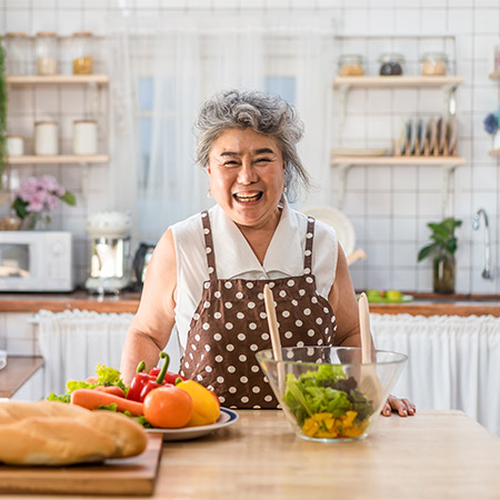 asian-elderly-grandmother-cooking-salad.jpg