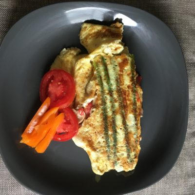 Eggs with asparagus, orange peppers, and tomatoes