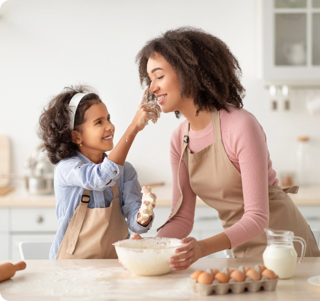 Black woman and daughter, baking