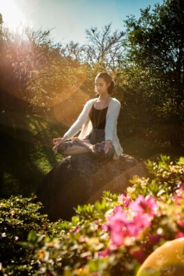 woman meditating outside