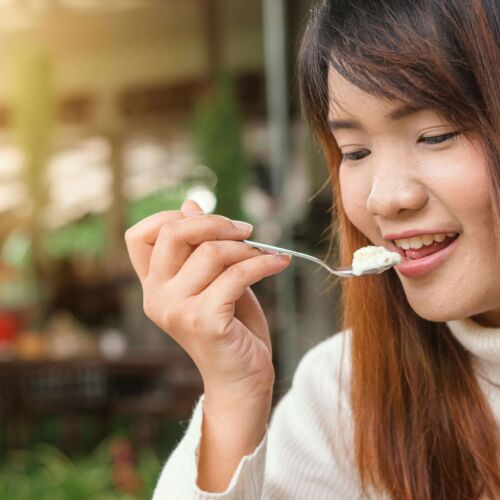 woman eating yogurt